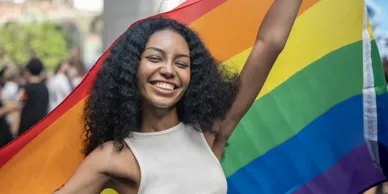 Happy woman with pride flag