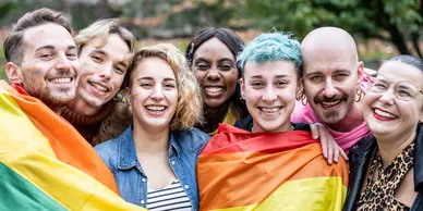 rs=w_388,h_194,cg_true (1) Happy LGBTQ youth with a pride flag